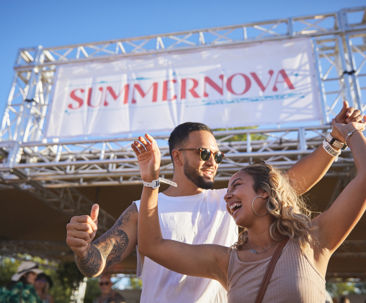 Couple Dancing And Laughing In Front Of Stage